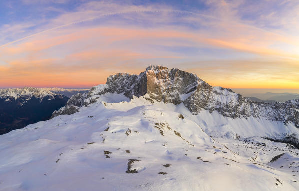 Aerial panorama of the snow-covered north face of the Presolana mountain in winter. Val di Scalve, Bergamo district, Lombardy, Italy, Southern Europe.
