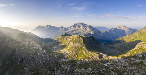 Sunrise over the Laghi Gemelli pass, with the two valley of the Valsecca torrent and Valcanale in the foreground divided by the Cima di Mezzeno and the Pizzo Arera behind. Val Brembana, Orobie Alps,  Bergamo district, Lombardy, Italy, Europe.