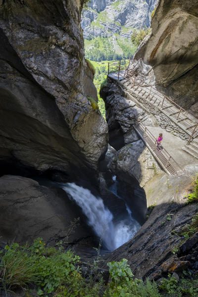 View of the trail inside the mountain following the course of the river Trümmelbach and it's waterfalls. Lauterbrunnen,Bernese Oberland, Canton of Bern, Switzerland, Europe.