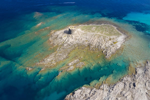 Aerial view of the small island and the medieval tower of La Pelosa, Stintino, Asinara Gulf, Sassari district, Sardinia, Italy.