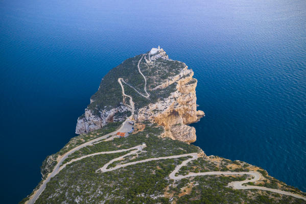 Aerial view of the rocky promontory of Capo Caccia and its lighthouse, Alghero,  Sassari district, Sardinia, Italy.