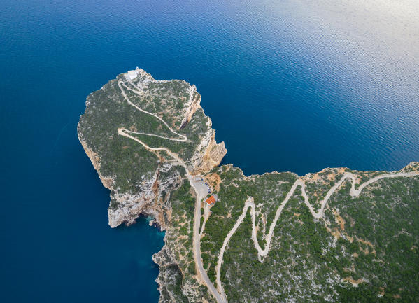 Aerial view of the rocky promontory of Capo Caccia and its lighthouse, Alghero,  Sassari district, Sardinia, Italy.
