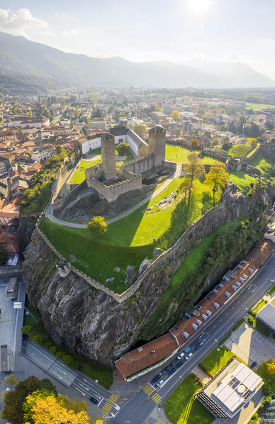 Aerial view of the medieval Bellinzona castles, Unesco World Heritage site, in autumn at sunset. Canton Ticino, Switzerland.
