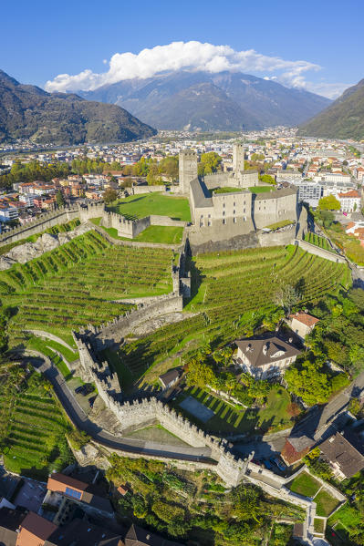 Aerial view of the medieval Bellinzona castles, Unesco World Heritage site, in autumn at sunset. Canton Ticino, Switzerland.