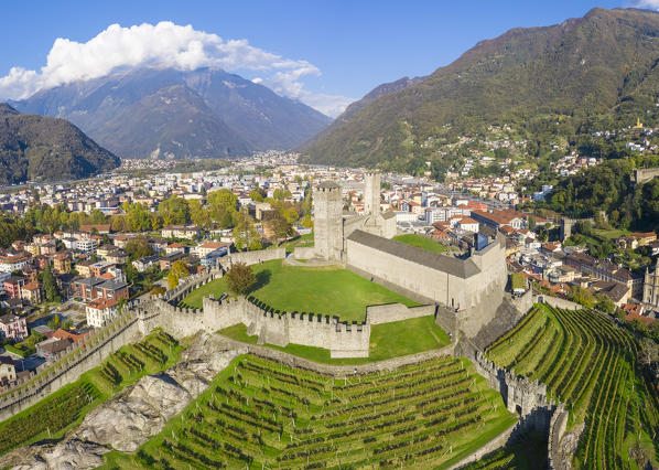 Aerial view of the medieval Bellinzona castles, Unesco World Heritage site, in autumn at sunset. Canton Ticino, Switzerland.