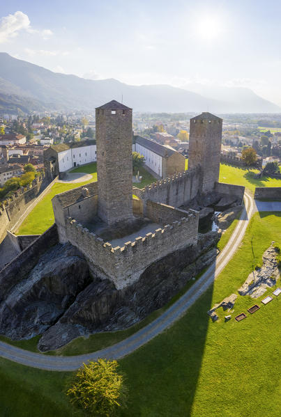Aerial view of the medieval Bellinzona castles, Unesco World Heritage site, in autumn at sunset. Canton Ticino, Switzerland.