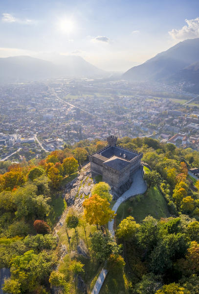 Aerial view of the medieval Bellinzona castles, Unesco World Heritage site, in autumn at sunset. Canton Ticino, Switzerland.