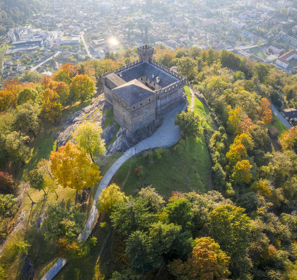 Aerial view of the medieval Bellinzona castles, Unesco World Heritage site, in autumn at sunset. Canton Ticino, Switzerland.