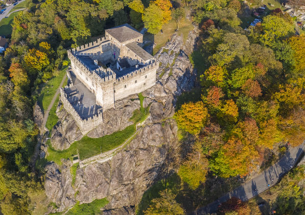 Aerial view of the medieval Bellinzona castles, Unesco World Heritage site, in autumn at sunset. Canton Ticino, Switzerland.