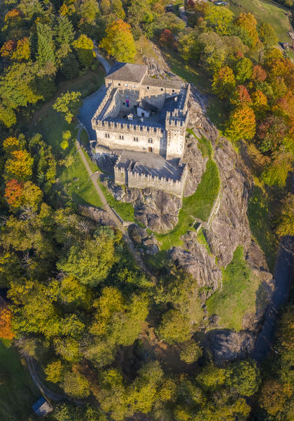 Aerial view of the medieval Bellinzona castles, Unesco World Heritage site, in autumn at sunset. Canton Ticino, Switzerland.