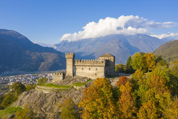 Aerial view of the medieval Bellinzona castles, Unesco World Heritage site, in autumn at sunset. Canton Ticino, Switzerland.