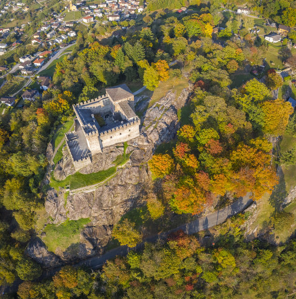 Aerial view of the medieval Bellinzona castles, Unesco World Heritage site, in autumn at sunset. Canton Ticino, Switzerland.