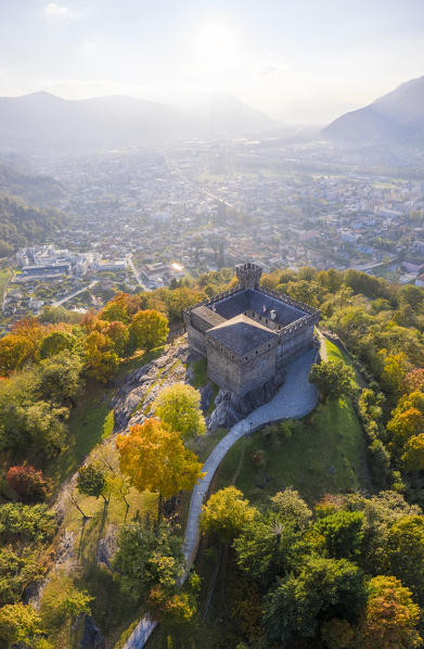 Aerial view of the medieval Bellinzona castles, Unesco World Heritage site, in autumn at sunset. Canton Ticino, Switzerland.