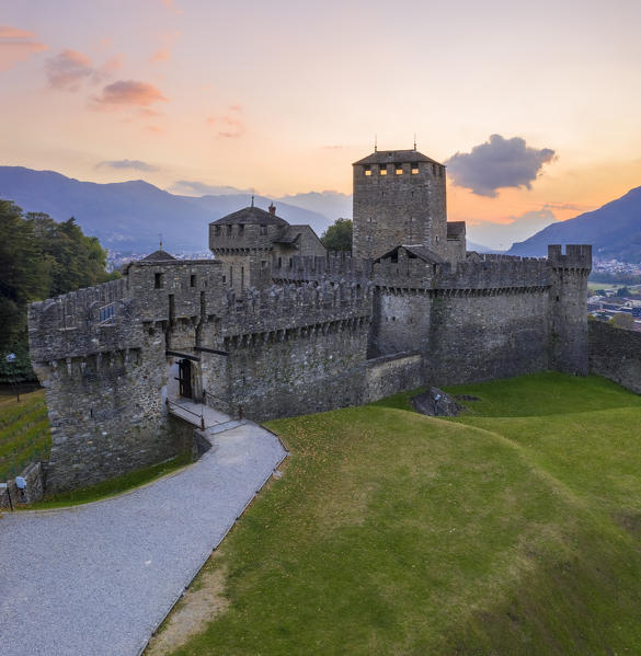 Aerial view of the medieval Bellinzona castles, Unesco World Heritage site, in autumn at sunset. Canton Ticino, Switzerland.
