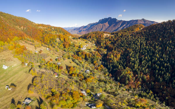 Aerial view of the autumnal colors at the Alpe Blitz mountain pasture with a view over mount Limidario in the back. Craveggia, Valle Vigezzo, val d'Ossola, Verbano Cusio Ossola, Piedmont, Italy.