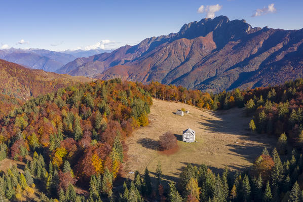Aerial view of the autumnal colors at the Alpe Blitz mountain pasture with a view over mount Limidario in the back. Craveggia, Valle Vigezzo, val d'Ossola, Verbano Cusio Ossola, Piedmont, Italy.