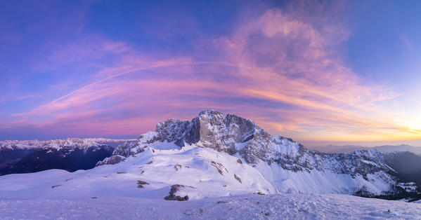 View of the snow-covered north face of the Presolana mountain in winter at sunset. Colere, Val di Scalve, Bergamo district, Lombardy, Italy, Southern Europe.