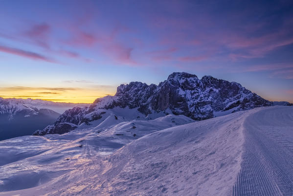 View of the snow-covered north face of the Presolana mountain in winter at sunrise. Colere, Val di Scalve, Bergamo district, Lombardy, Italy, Southern Europe.