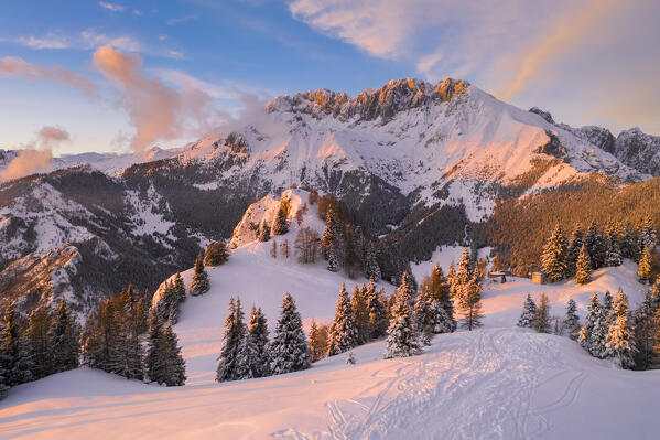 Aerial view of the Presolana covered in snow at sunset from Mount Scanapà. Castione della Presolana, Val Seriana, Bergamo district, Lombardy, Italy.
