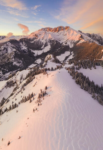 Aerial view of the Presolana covered in snow at sunset from Mount Scanapà. Castione della Presolana, Val Seriana, Bergamo district, Lombardy, Italy.