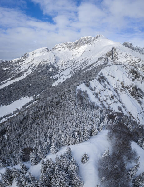 Aerial view of Monte Gulter and the Presolana massif after a winter snowfall. Presolana pass, Castione della Presolana, Seriana Valley, Bergamo province, Lombardy, Italy.