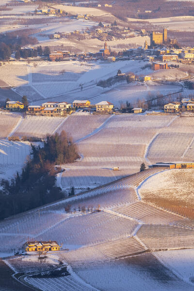 Winter sunset on the medieval town of Serralunga d'Alba and its castle viewed from La Morra. Serralunga d'Alba, Langhe, Piedmont, Italy, Europe.