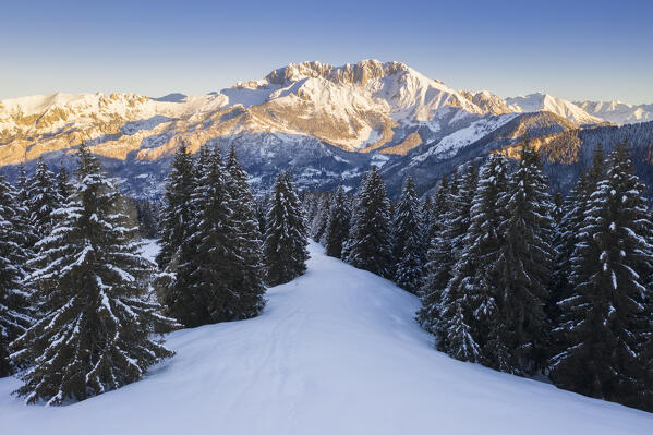 Aerial view of the Presolana massif during a winter sunrise from Monte Pora, Val Seriana, Bergamo district, Lombardy, Italy.