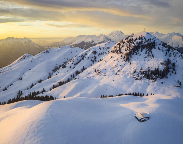 Sunset over a snowy Monte Farno and Pizzo Formico in winter. Monte Farno, Gandino, Valgandino, Val Seriana, Bergamo province, Lombardy, Italy.