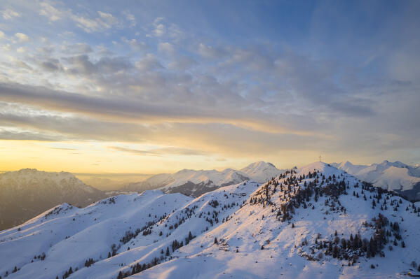 Sunset over a snowy Monte Farno and Pizzo Formico in winter. Monte Farno, Gandino, Valgandino, Val Seriana, Bergamo province, Lombardy, Italy.