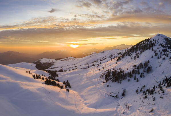 Sunset over a snowy Monte Farno and Pizzo Formico in winter. Monte Farno, Gandino, Valgandino, Val Seriana, Bergamo province, Lombardy, Italy.