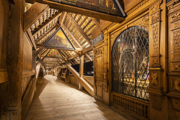 View of the wooden footbridge of Spreuerbrücke at night with the paintings of the Totentanz cycle by Kaspar Meglinger. Lucerne, canton of Lucerne, Switzerland.
