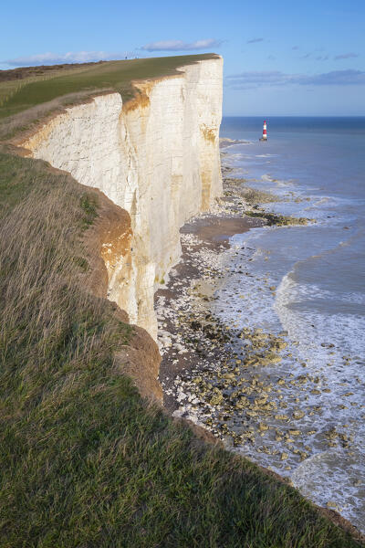 View of Beachy Head, a chalk headland in East Sussex, immediately east of the Seven Sisters and it's lighthouse. Eastbourne, East Sussex, Southern England.