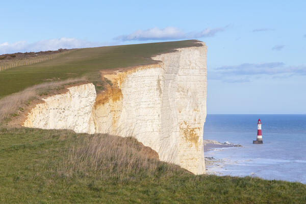 View of Beachy Head, a chalk headland in East Sussex, immediately east of the Seven Sisters and it's lighthouse. Eastbourne, East Sussex, Southern England.