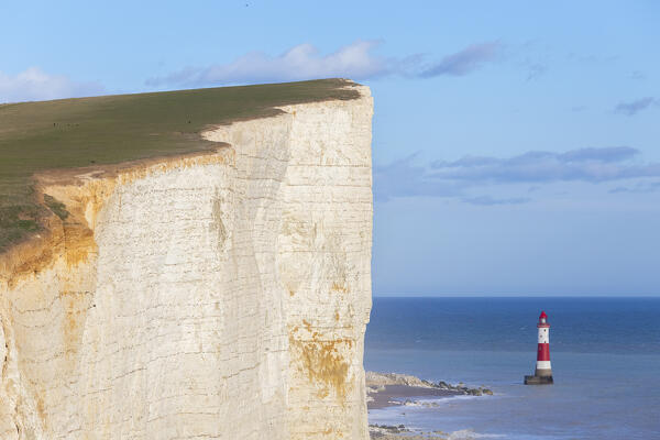View of Beachy Head, a chalk headland in East Sussex, immediately east of the Seven Sisters and it's lighthouse. Eastbourne, East Sussex, Southern England.