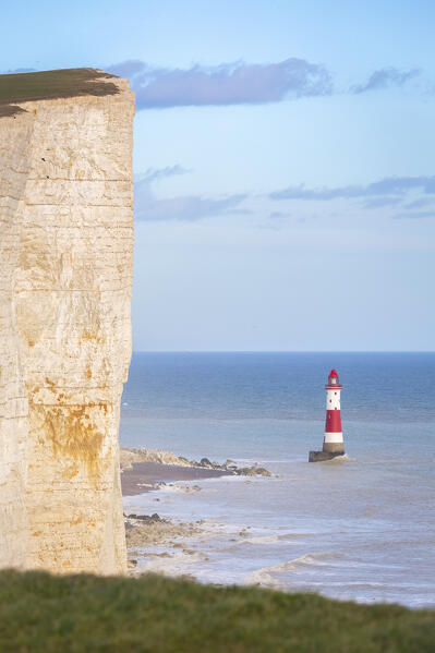View of Beachy Head, a chalk headland in East Sussex, immediately east of the Seven Sisters and it's lighthouse. Eastbourne, East Sussex, Southern England.