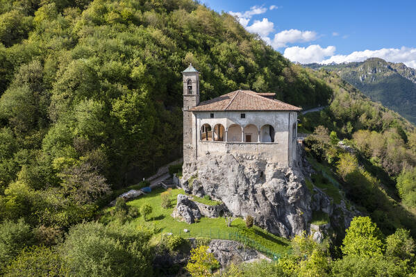 Aerial view of the San Patrizio sanctuary on a hill overlooking Casnigo and Valle Seriana. Val Seriana, Bergamo province, Lombardy, Italy.