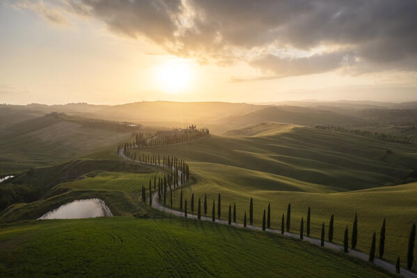 Aerial view of the farmhouse Baccoleno at sunset. Asciano, Siena province, Tuscany, Italy. 