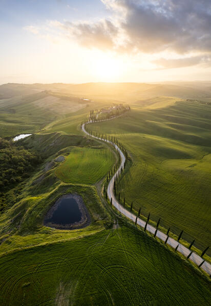Aerial view of the farmhouse Baccoleno at sunset. Asciano, Siena province, Tuscany, Italy. 