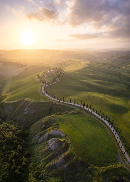 Aerial view of the farmhouse Baccoleno at sunset. Asciano, Siena province, Tuscany, Italy. 