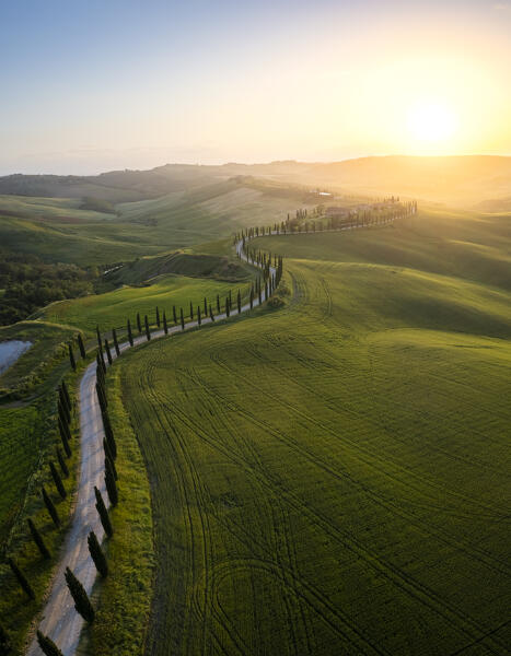 Aerial view of the farmhouse Baccoleno at sunset. Asciano, Siena province, Tuscany, Italy. 