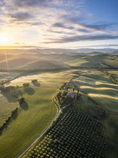 Aerial view of the famous Podere Belvedere and the surrounding countryside at sunrise. San Quirico d'Orcia, Val d'Orcia, Tuscany, Italy.

