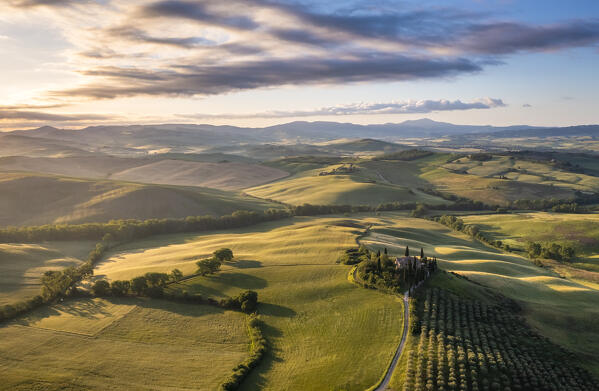 Aerial view of the famous Podere Belvedere and the surrounding countryside at sunrise. San Quirico d'Orcia, Val d'Orcia, Tuscany, Italy.
