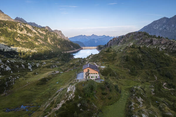 View of the Rifugio Calvi and Fregabolgia lake at sunrise. Carona, Val Brembana, Alpi Orobie, Bergamo, Bergamo Province, Lombardy, Italy, Europe.
