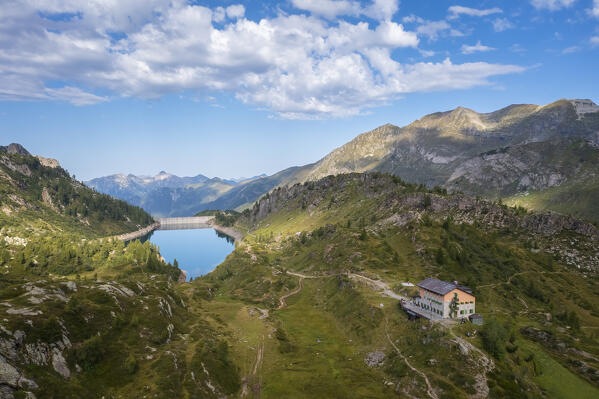 View of the Rifugio Calvi and Fregabolgia lake at sunrise. Carona, Val Brembana, Alpi Orobie, Bergamo, Bergamo Province, Lombardy, Italy, Europe.