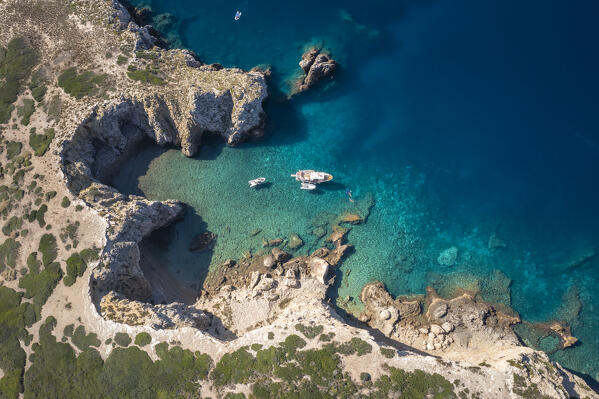 View of a boat at Cala Sorrentino on Isola di Capraia. Tremiti Islands, Foggia district, Puglia, Italy.