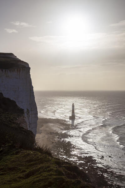 View of Beachy Head, a chalk headland in East Sussex, immediately east of the Seven Sisters and it's lighthouse. Eastbourne, East Sussex, Southern England.