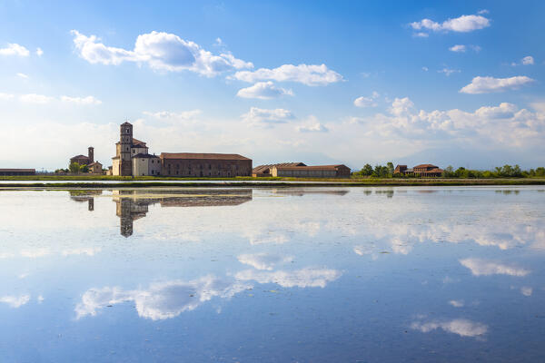 View of reflecting clouds on the rice fields of the Principality of Lucedio. Trino Vercellese, Vercelli district, Piedmont, Italy.