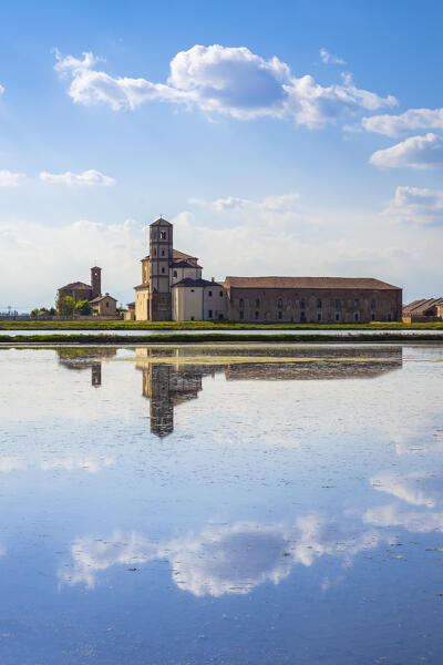 View of reflecting clouds on the rice fields of the Principality of Lucedio. Trino Vercellese, Vercelli district, Piedmont, Italy.