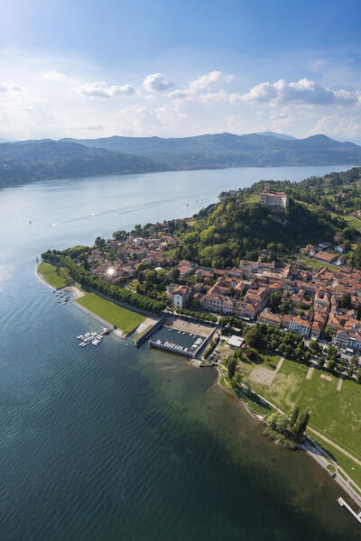 View of the town of Angera and its fortress called Rocca di Angera on a spring day. Angera, Lake Maggiore, Varese district, Lombardy, Italy.
