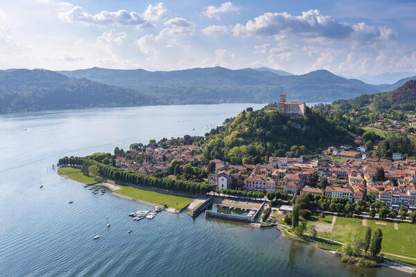 View of the town of Angera and its fortress called Rocca di Angera on a spring day. Angera, Lake Maggiore, Varese district, Lombardy, Italy.